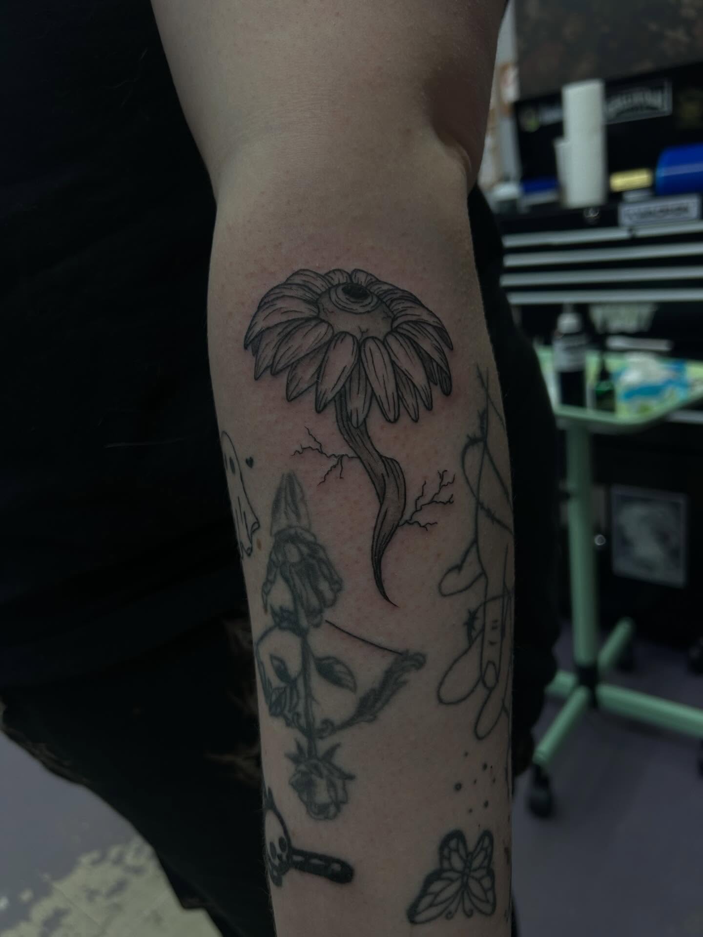 Eye flower tattoo